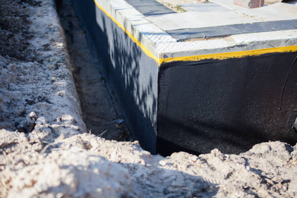 Professional Waterproofing technician working in Glencoe, KY